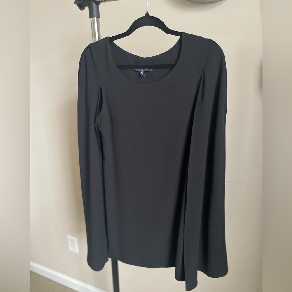 Black dress with cape, knee length, for office or outings.